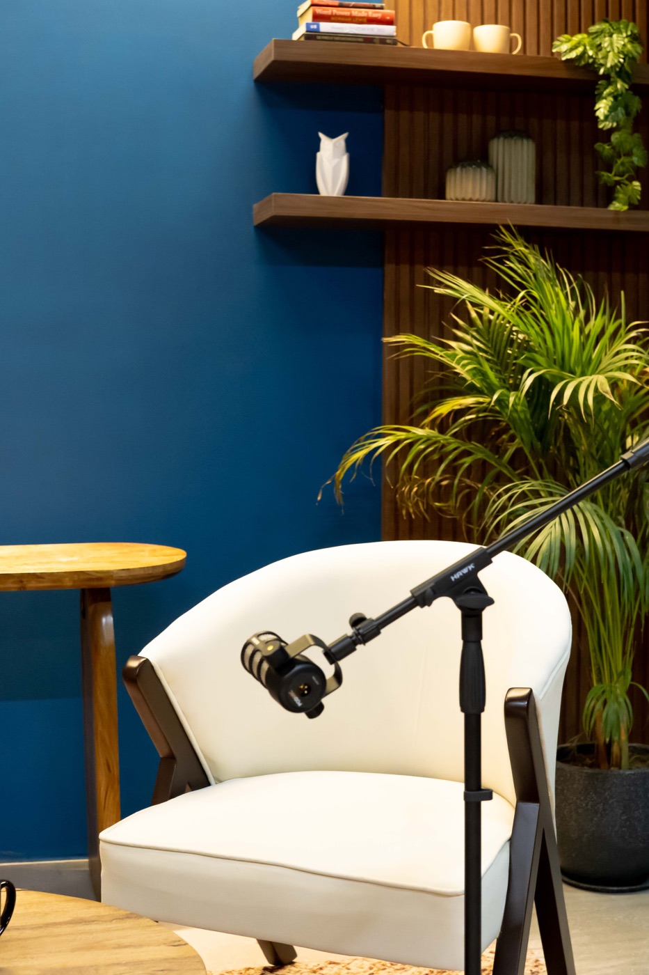 Premium podcast studio interior with warm lighting
